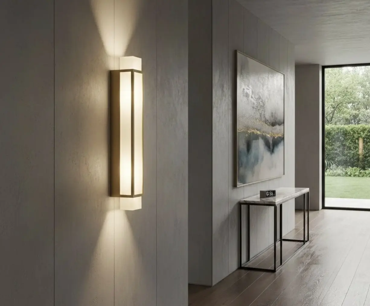 A contemporary brass wall light in a modern hallway